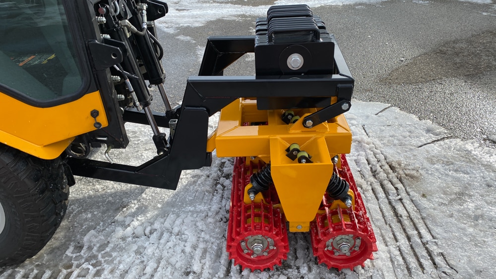 trackless vehicles snow lion ice-breaker attachment close-up side view