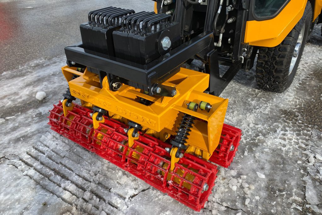 trackless vehicles snow lion ice-breaker attachment close-up