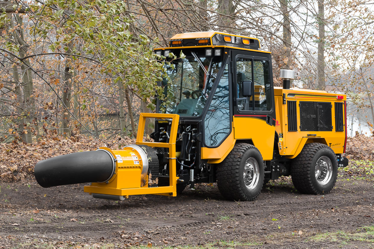 trackless vehicles buffalo turbine debris blower attachment on sidewalk municipal tractor blowing leaves side view