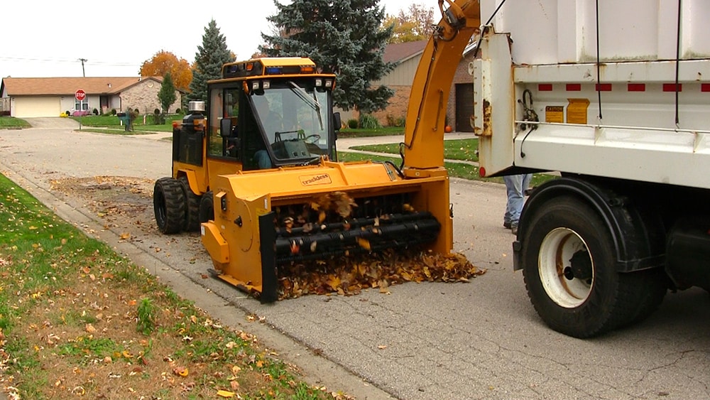 snow on ground after trackless vehicles 5-position folding v-plow attachment on sidewalk tractor