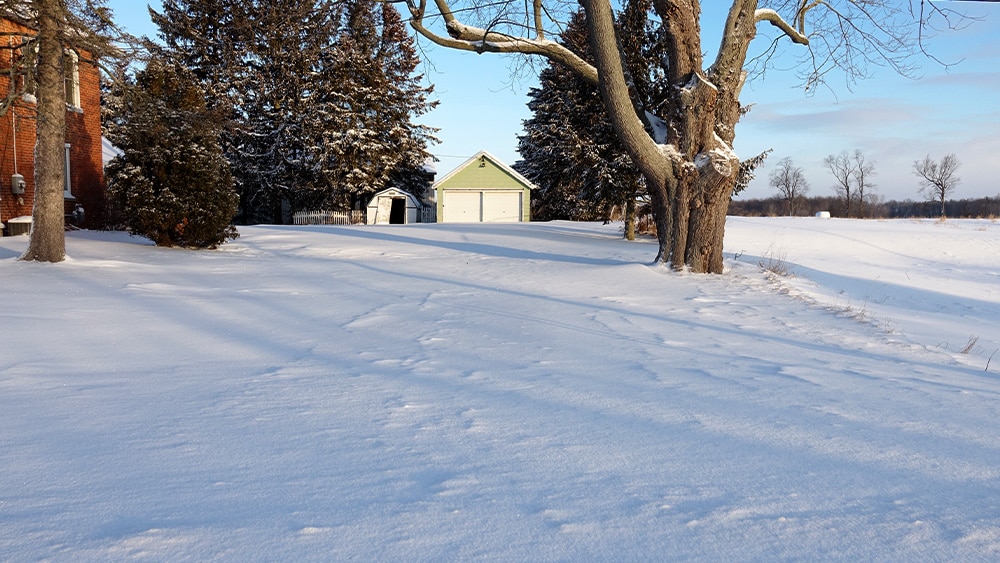 snow on ground before trackless vehicles 5-position folding v-plow attachment on sidewalk tractor